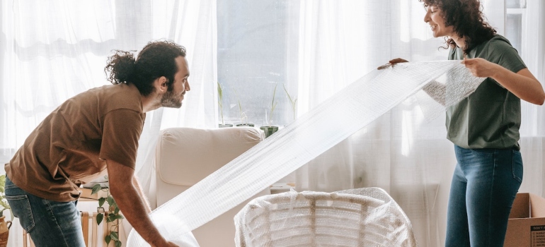 a man and a woman packing