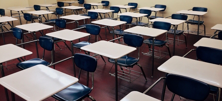 a classroom with tables and chairs
