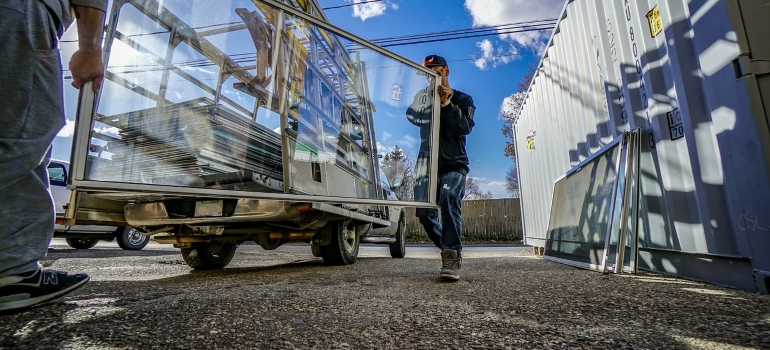movers carrying windows when moving from Coral Gables to Hollywood