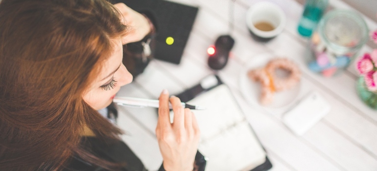 a woman thinking about techniques for storing office documents