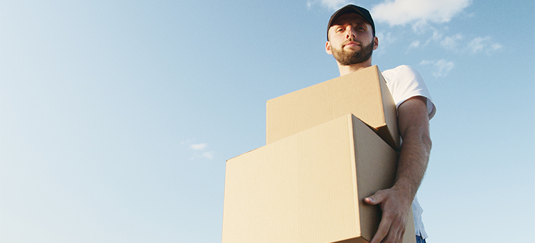 movers Fort Lauderdale FL carrying a box