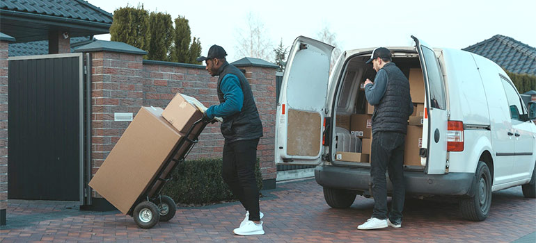 movers Downtown Miami unloading a van