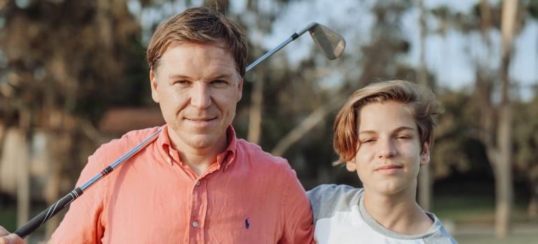 Father and son playing golf