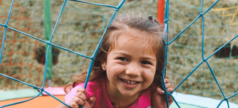 A happy kid playing outside after moving to Florida