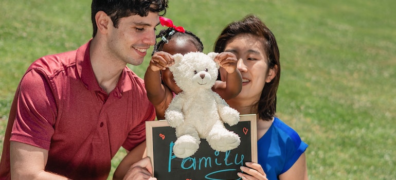 A happy family spending time with their kid