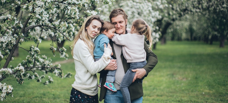A happy family hugging each other, after they explored some of the stunning hiking Florida destinations.