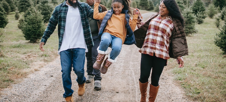 Parents going on a hike with their daughter.