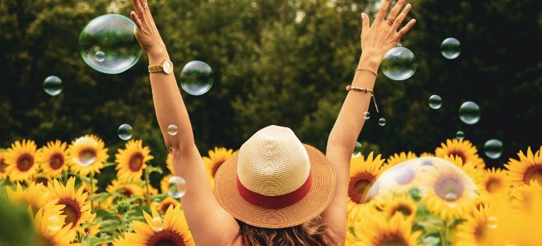 woman in a field of sunflowers