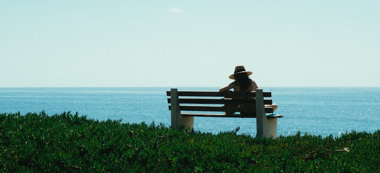 enjoying on a bench in one of the top FL places for solo travelers