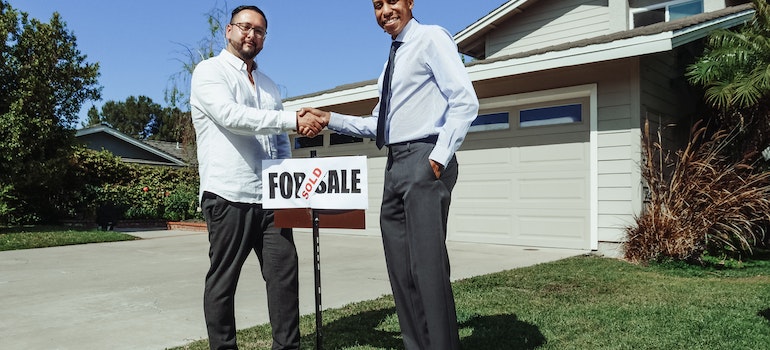 shaking hands after buying a home