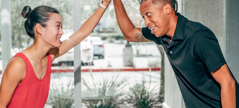 happy couple after deciding between buying vs renting a home in Miami in 2023