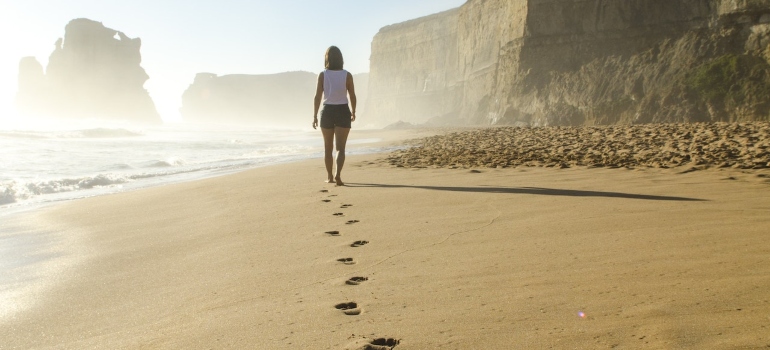 a person walking on a beach