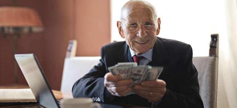 senior holding cash