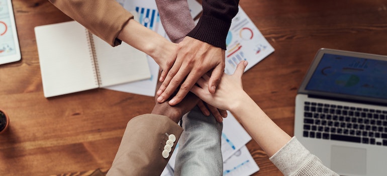 people holding hands while discovering business opportunities in Pompano Beach