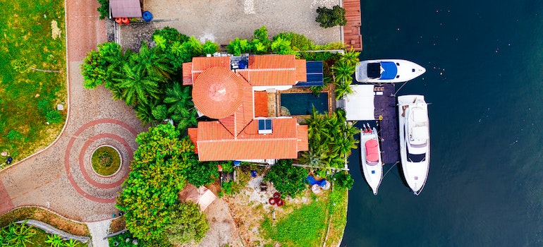 looking at a waterfront home while exploring Hallandale Beach real estate market