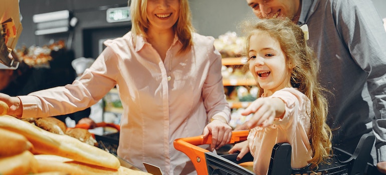 family buying groceries after relocating from Boca Raton to Coral Springs