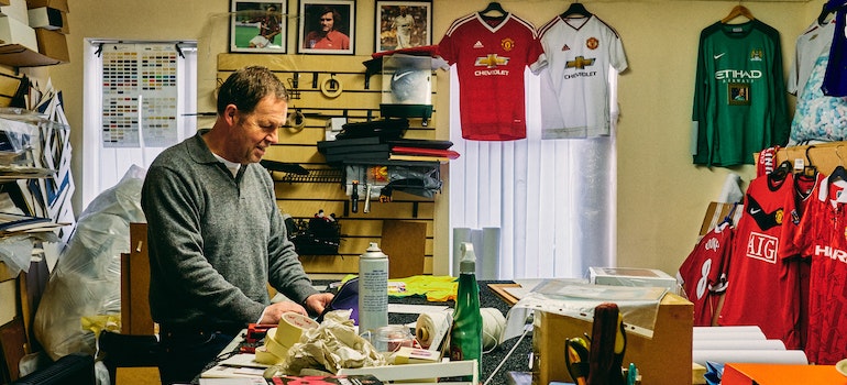 man in cluttered room
