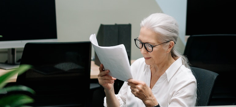 woman reading papers
