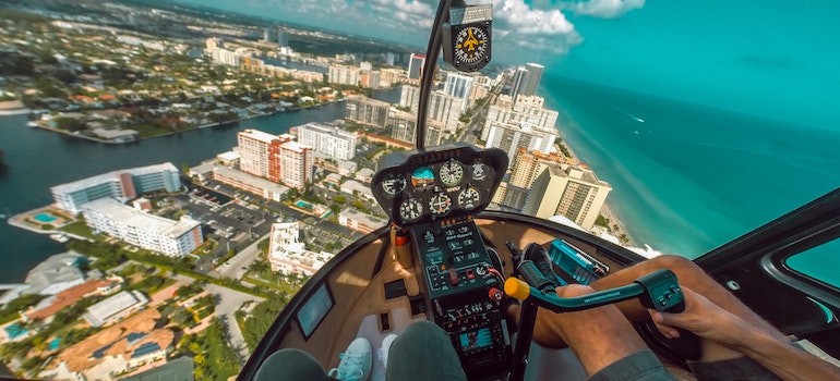 flying across the city and thinking about moving from apartment to house in Miami