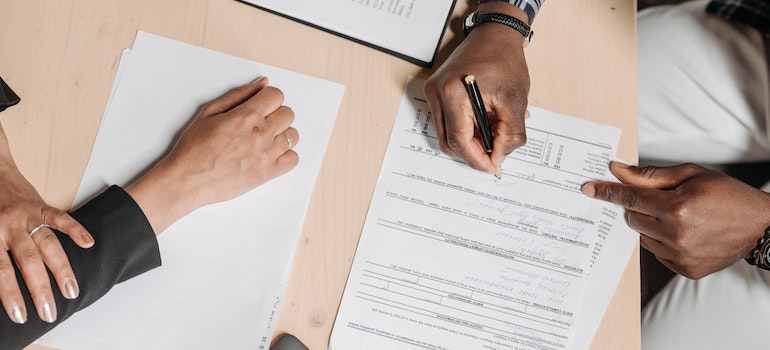 signing papers after moving your restaurant to Miami