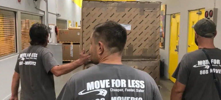 Miami movers carrying moving boxes