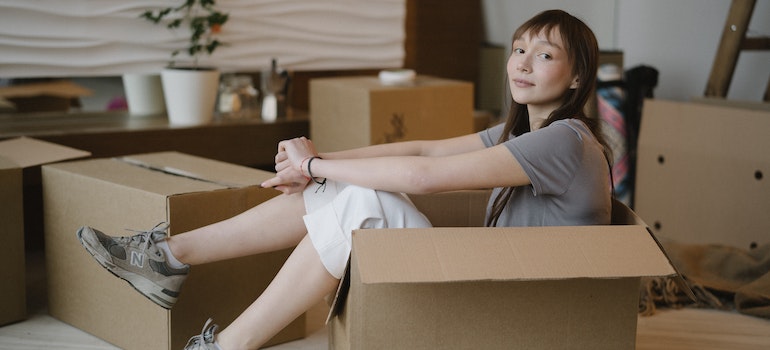 girl sitting in a box