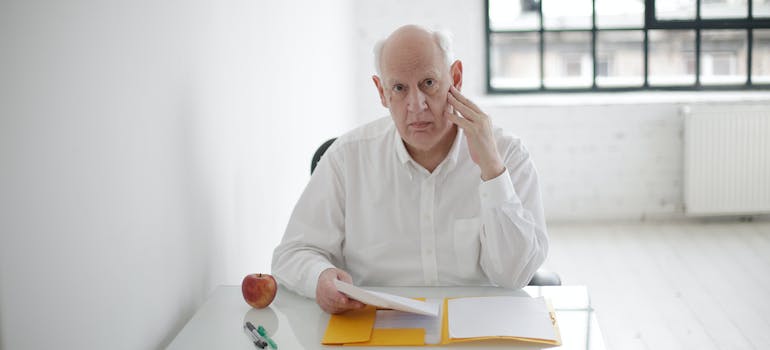 elderly reading contract before choosing a Florida retirement home