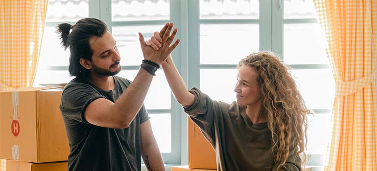 happy couple packing