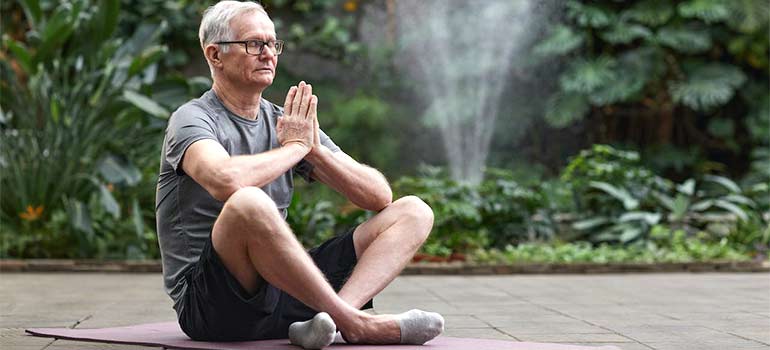 meditating in one of the top cities in South Florida for seniors