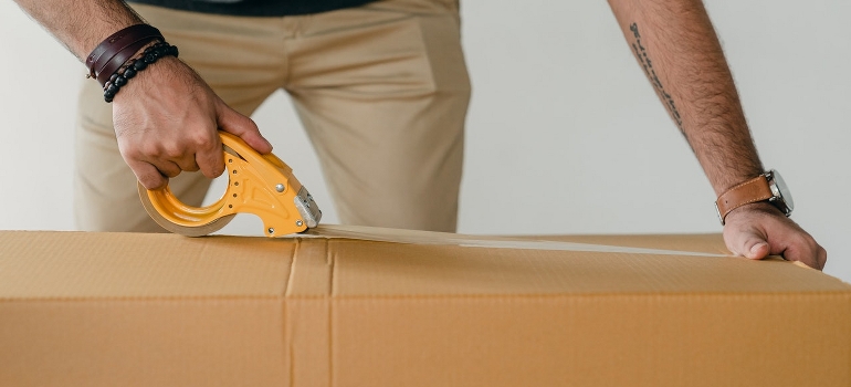 a man packing a box