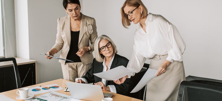 office team discussing employee relocation packages