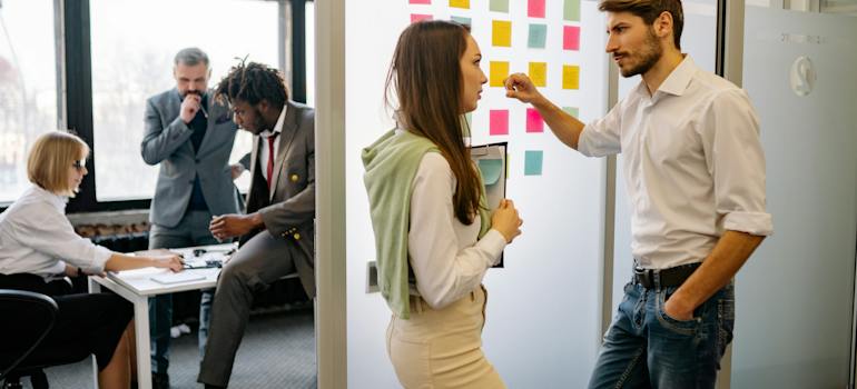 colleagues talking about minimizing downtime in office relocations