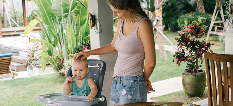 woman taking care of a baby