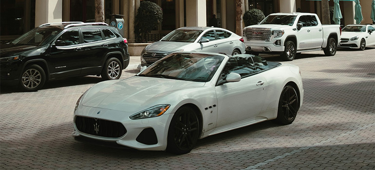 living in Boca Raton and driving a fancy car