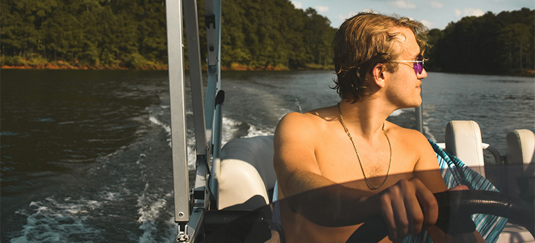a man driving a boat