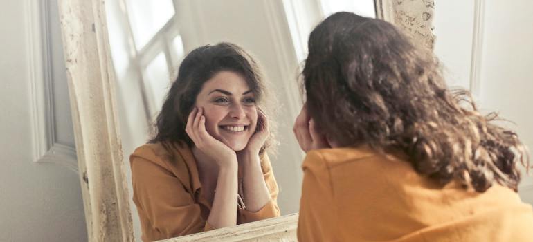 woman happy after a move to a smaller self-storage space