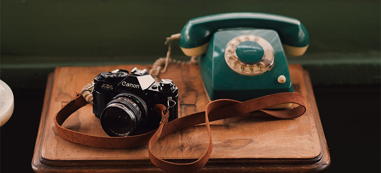 looking at old camera and phone when deciding about selling or moving your belongings