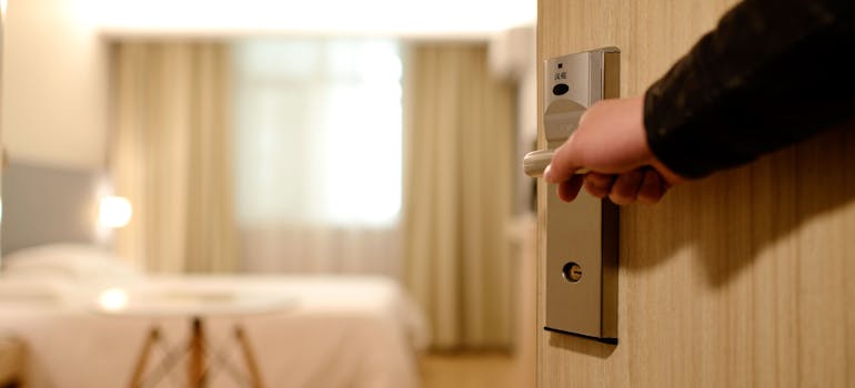 opening a door to a new home after selling or moving your belongings