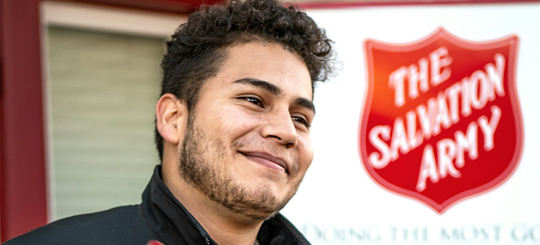 a man in front of the salvation army after decluttering in Pembroke Pines