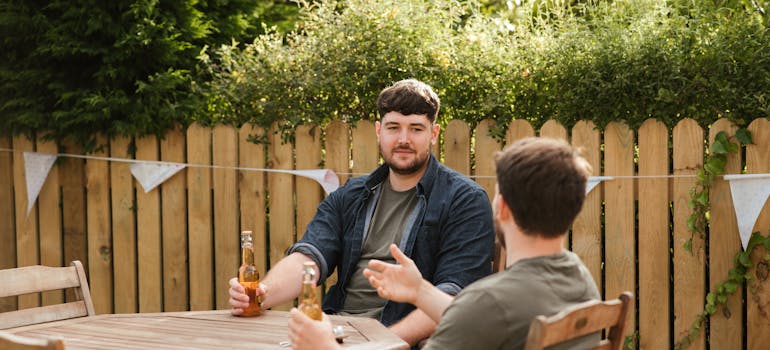 two men trying to minimize neighbor complaints during your move