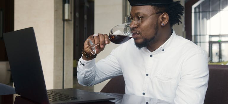 drinking wine and looking for movers to help you with relocating your wine collection