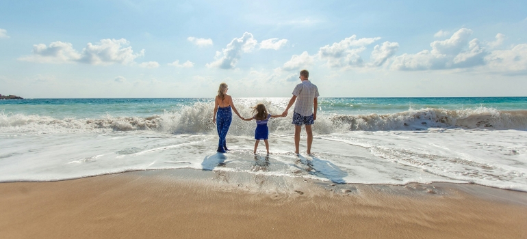 family on the beach talking about the health benefits of living in Florida