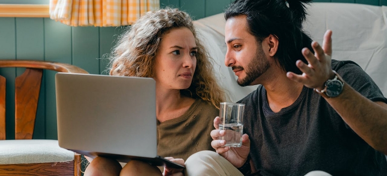 couple talking about moving to a beach house