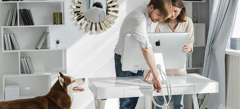 couple moving a computer