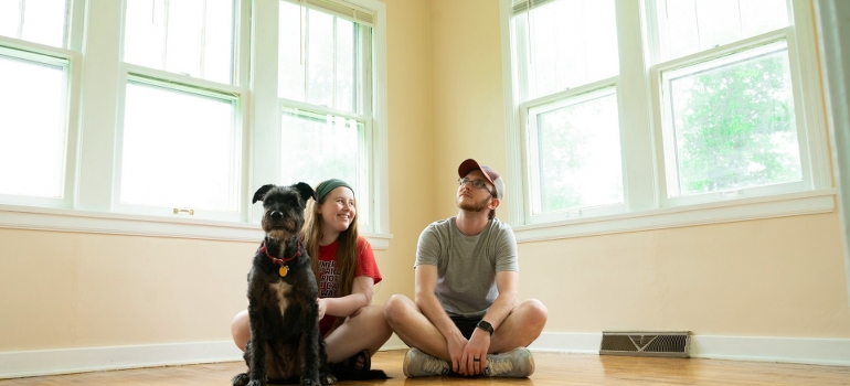 couple and a dog in a house