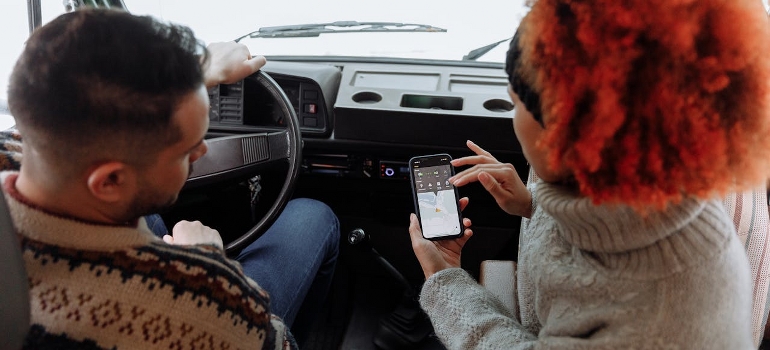 couple in a car looking at google maps