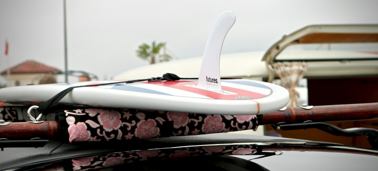 Moving surfboards across Miami on a car